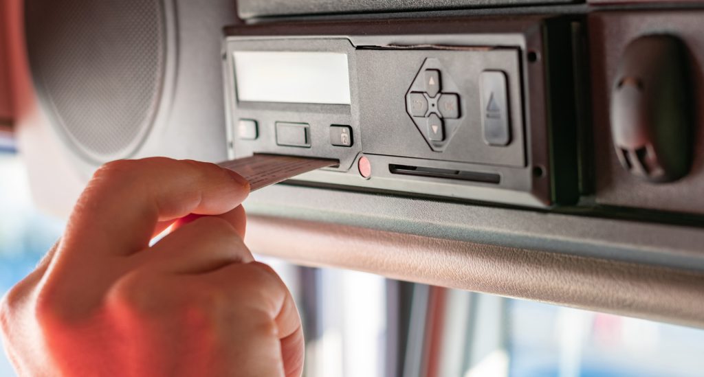 truck driver performing driver card and menu operations on the t