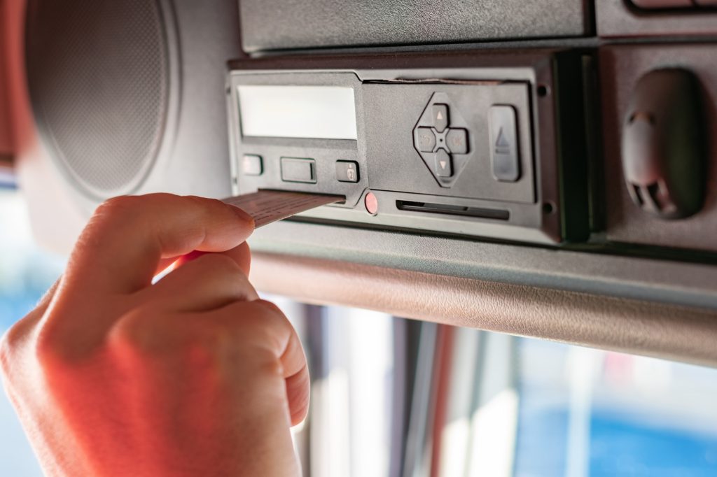 truck driver performing driver card and menu operations on the t
